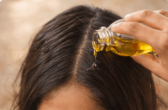 Part and apply step in the RUVS Naturals hibiscus hair oil routine